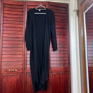 Never worn, long rubbed duster with slit details at the bottom.